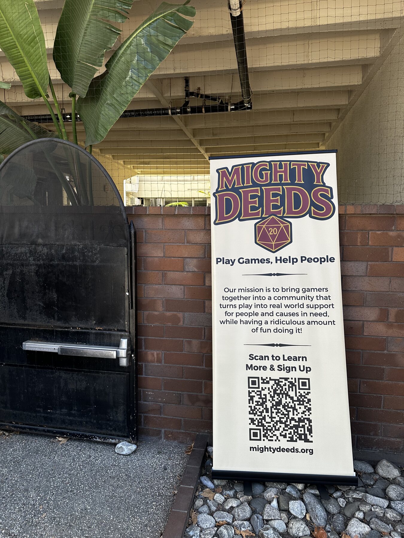 Mighty Deeds event sign at Encompass Housing