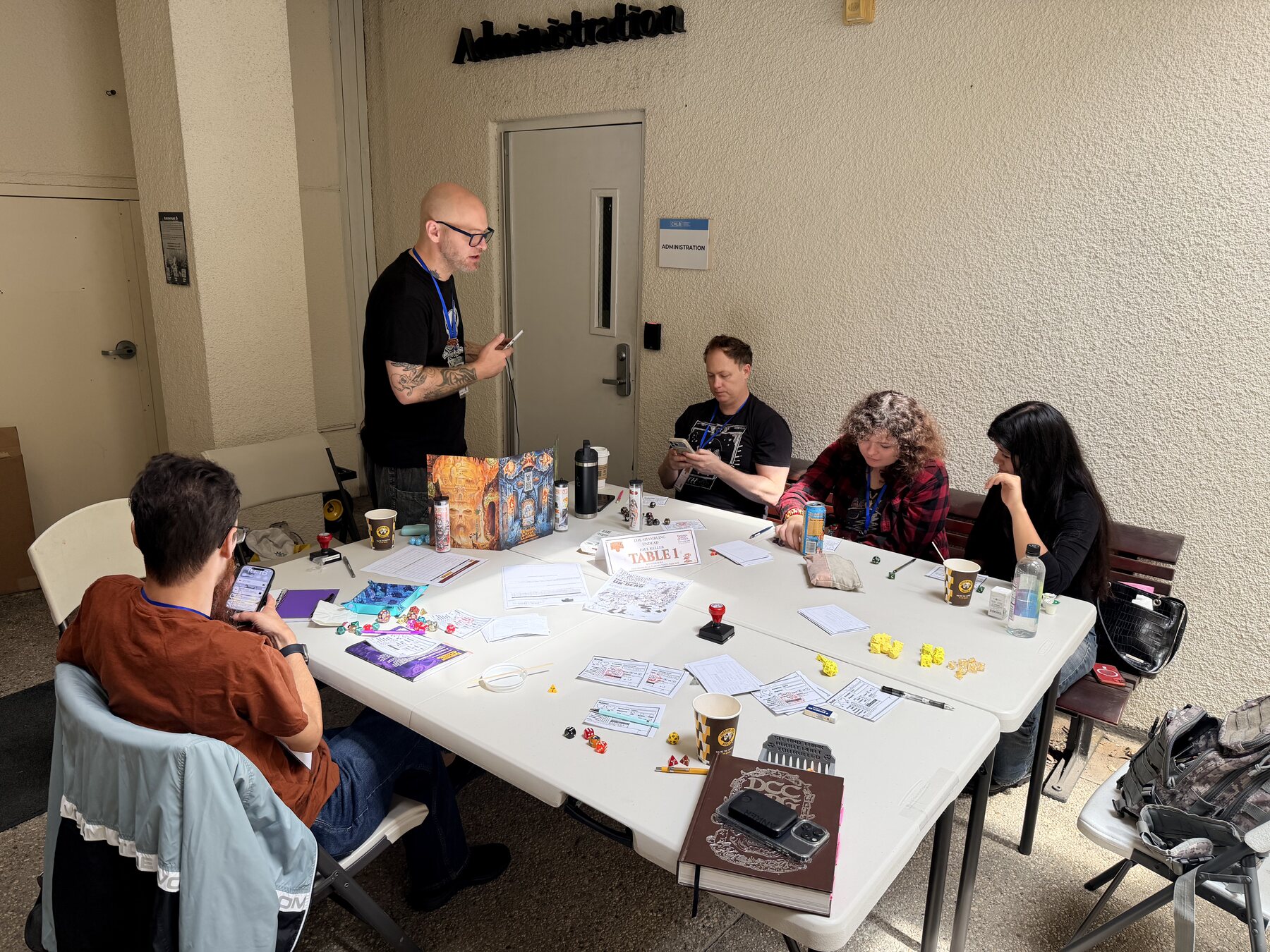 Players and Game Master at a Mighty Deeds Summer 2026 table