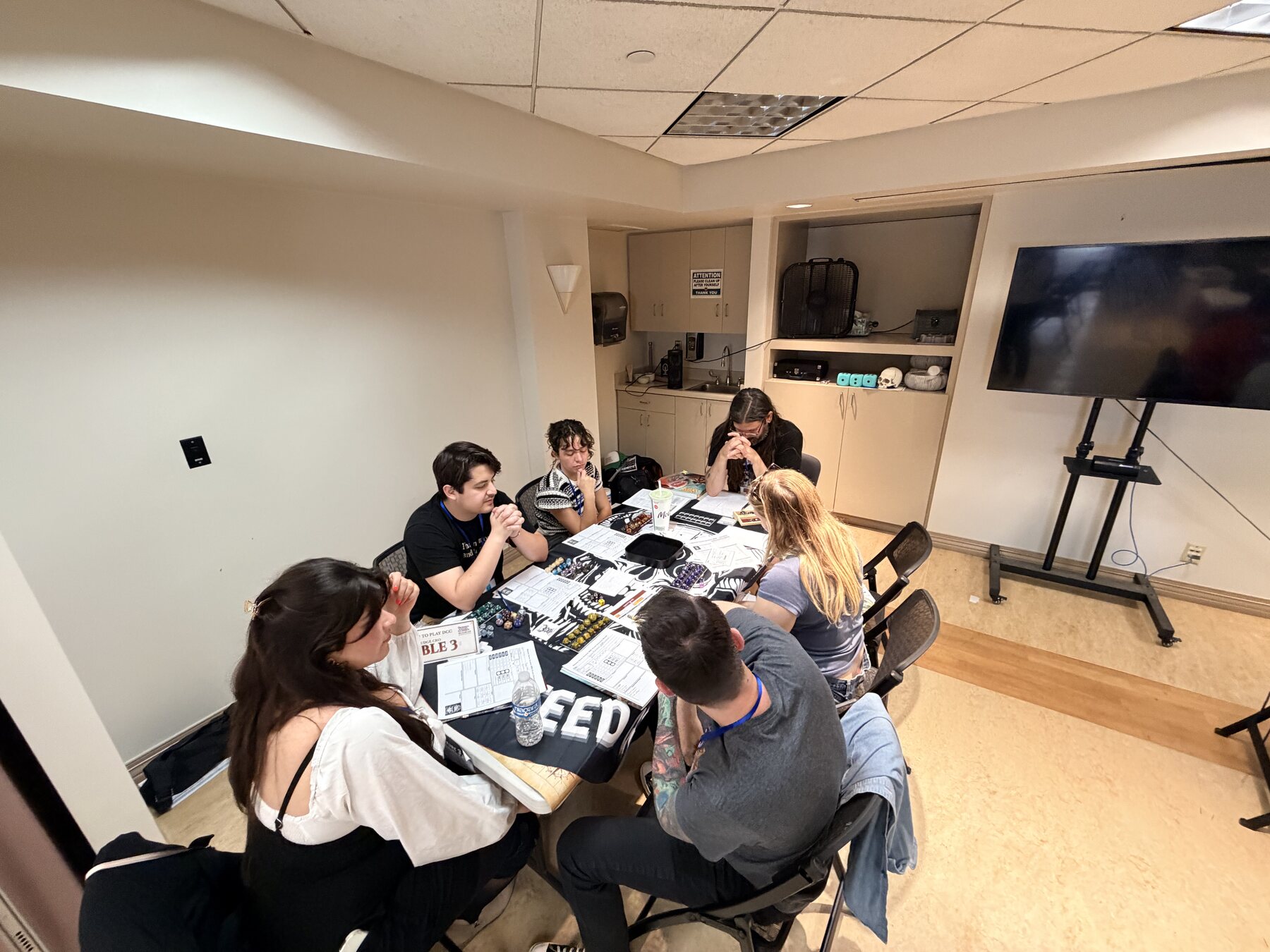 Game table with players gathered for Mighty Deeds Summer 2026